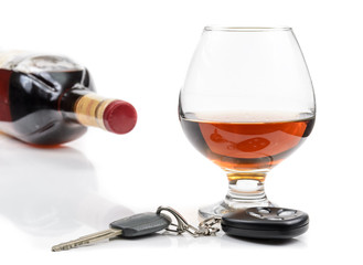 glass of alcohol and car keys