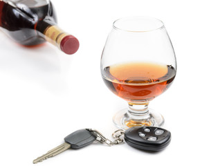 glass of alcohol and car keys