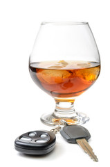 glass of alcohol and car keys