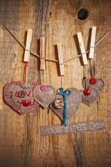 Decoration on Wooden background with fabric Hearts and words Val