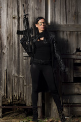 Naklejka premium beautiful girl with weapon