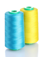 Bobbins of thread isolated on white