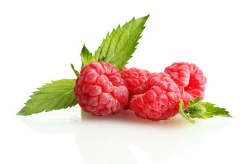 ripe raspberries with mint  isolated on white