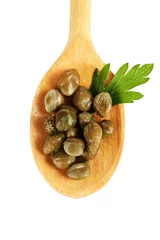 Zelfklevend Fotobehang green capers in wooden spoon on white background close-up © Africa Studio