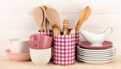 Cups, bowls nd other utensils in metal containers isolated