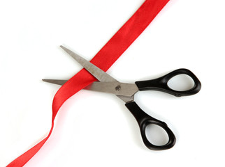 Cutting red ribbon isolated on white