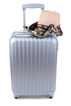 Silver suitcase with  hat  isolated on white