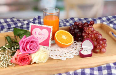 Breakfast in bed on Valentine's Day on room background