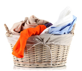 Bright clothes in laundry basket, isolated on white