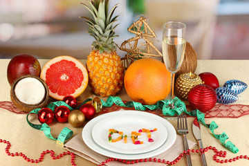 Dietary food on New Year's table on room background