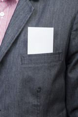 Businessman holding blank card