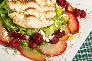 Chicken salad with plums and raspberries