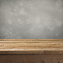 Retro background with wooden table and gray backdrop