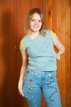 girl shows   cloth beaded by herself