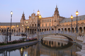 Fototapeta na wymiar Romantic bridge over the canal in Spain Square, Seville (Spain)