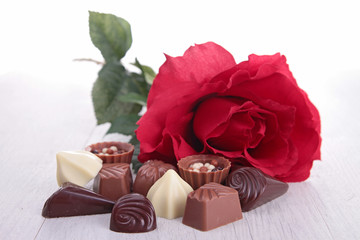 assortment of chocolate and red rose