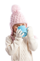 Little girl drinking hot beverage.