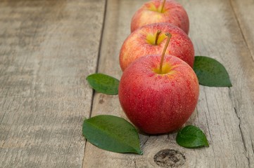 Fresh apples on the wooden floor