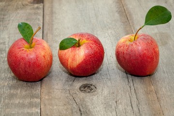 Fresh apples on the wooden floor