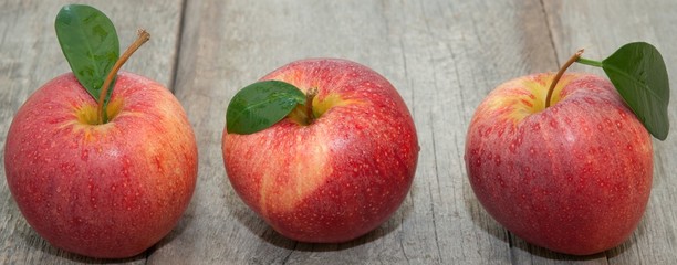 Fresh apples on the wooden floor