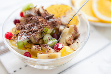 sweet fruit and berry salad with grated chocolate