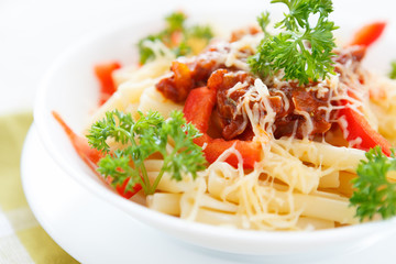 pasta with vegetable sauce and parmesan cheese