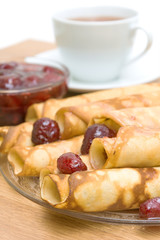 Pancakes with strawberry jam close up
