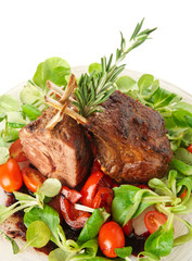 Rare fried rack of lamb isolated on white