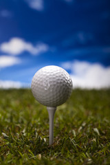 Golf ball on green meadow