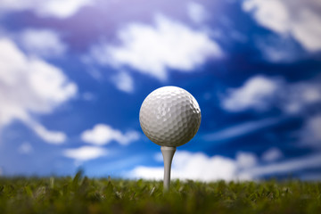 Golf ball on green meadow