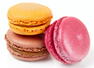 Three colorful macarons on white background