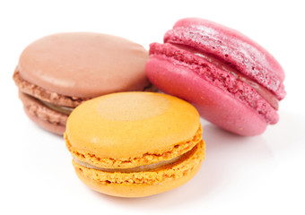 Three colorful macarons isolated on white
