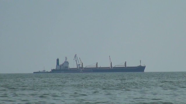 Cargo ship floating at sea