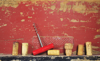 collection of wine corks and a corkscrew