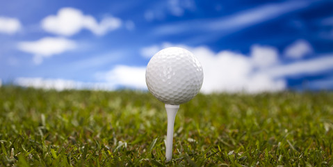 Golf ball on green meadow