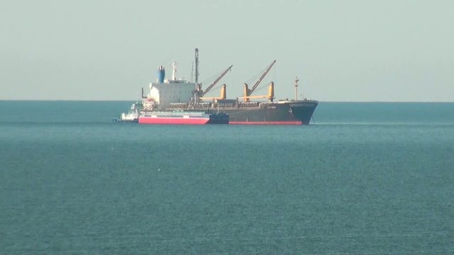 Cargo ship traveling across the sea