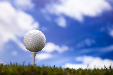 Golf ball on green meadow