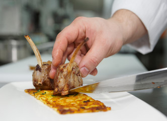Chef is making meat dish