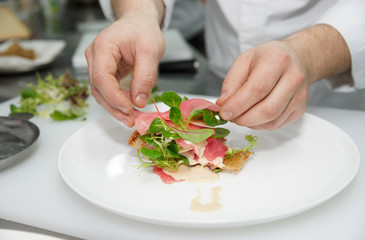 Chef is cooking appetizer