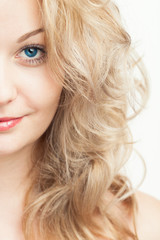 Fototapeta premium Half-Face Portrait of Beautiful Blonde Woman