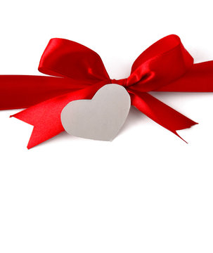 satin gift bow and white  heart, isolated on white background