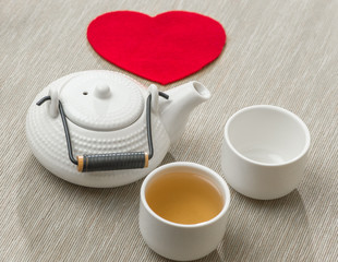 Valentine's day surprise for couple. Romantic tea set with red h