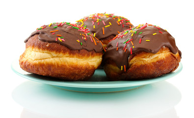 Tasty donuts on color plate isolated on white