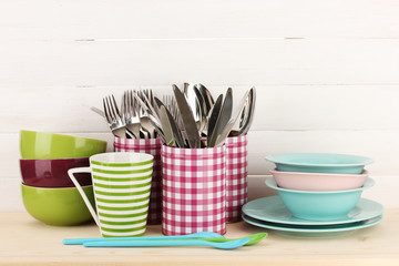 Cups, bowls nd other utensils in metal containers isolated