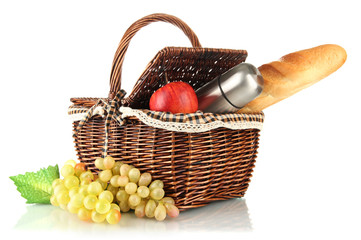 Picnic basket with fruits,bread and thermos isolated on white