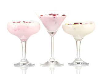 Glasses of yoghurt dessert with fruits and berries, isolated