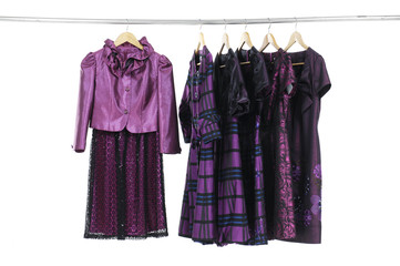 Variety of evening gown clothing on hanging