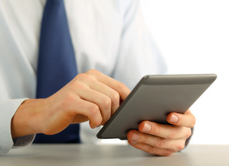 Businessman using computer plane-table