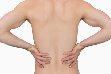 Fototapeta na wymiar Rear view of muscular man with backache