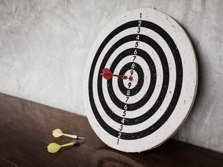 Success concept, darts hit target on dartboard